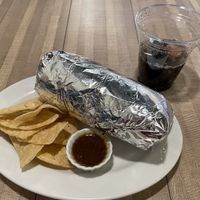 Large vegan burrito with chips and a drink! 1,600 yen. Filling but very bland… no spices. ^ - ^  at OC Burrito in Kyoto