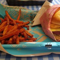Vegan Mango onion burger with sweet potato fries at Bobby Burger in Sopot