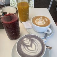 Cold pressed beetroot-apple and mango-apple juices form a Hungarian brand, butterfly pea latte and cafe latte with oat milk  at Briós in Budapest