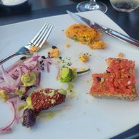 Remnants of the tapas after I forgot to take a picture. Pan con tomate and potato croquettes at Alcanada 35 in Mallorca