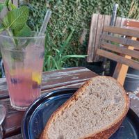 Raspberry Lime Lemonade & a raw slice of their bread at Bros Beans & Beats in Zurich