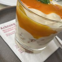 Soy yoghurt with mango purée and granola  at Mein Beck in Lana