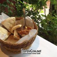 Pre-meal basket of pita and veggie spread at Ariana Cafe in Huntington