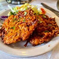 
Onion Bhaji  £4.95

Onions & vegetables mixed with herbs & spices, deep fried
 at Prince Of India  in Isle Of Skye