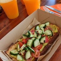 Avocado toast with orange juice at Bohemia The Journey in Santorini