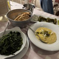 Greek greens, stuffed vine leaves (the tzaziki served with them is NOT vegan), pita and fava bean dip   at Ouzeri in Santorini