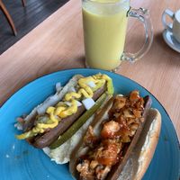 Mango smoothie with oat milk, city slicker hotdog, kimchi hotdog.   at Un Mundo Café in Springfield