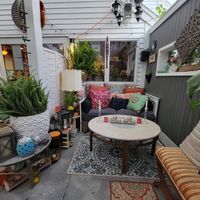 Outdoor covered patio seating option at Abroad in Orleans