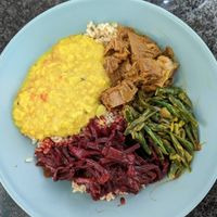 Four vegan curries: dahl, beetroot, jackfruit and green bean. (Note: This is from a takeaway so the plate and brown rice are mine.) at Lankan Railway Cafe in Mortdale