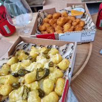 Cauliflower wings and cheesy potato tots with jalapeño at Papa John's in Slough