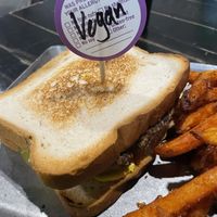 Blackies veggie pattie. Has a mostly black bean and potato-ish feel to it. Classic white bread only bun option labeled vegan  at Blackie's in Smithfield