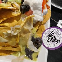 Fresno pepper. Olive. Cheese. Lettuce. Avocado  Bean puree and im not sure what the green sauce is.  at Blackie's in Smithfield