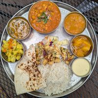 clockwise from naan:  aloo mutter, dal curry, chana masala, sambar, aloo ?, coconut chutney, vegetable pakora at Swagat Indian Cuisine  in Portland