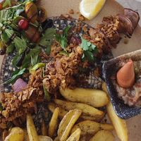 The front plate is vegan souvlaki.  at Mama Sofia in Rhodes