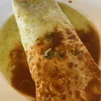 Veggie burrito without cheese or queso. Inside was a ton of veggies, black beans, rice, and lettuce    at Santo Coyote Mexican Food & Tequila Bar in North Little Rock