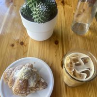 almond croissant and oat milk latte  at Rons Coffee House in South East London