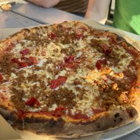 Field roast pizza with vegan cheese  at Humble Pie in Seattle