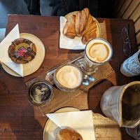 Vegan creme brulee donut, deluxe cookie (with allot of chocolate) and vegetarian croissant with black coffee, oat cappuccino and oat latte❤️ at Bird Flower in The Hague