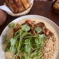 Parsnip crème with shiitake stew and sourdough bread on the sidee  at Bird Flower in The Hague