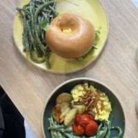 Bagel with tofu scramble and brekkie bowl   at Holy Llama  - Imittos in Athens