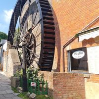 Working Water wheel in the courtyard garden and the mill workings are available to see inside the Tearoom.  at The Old Mill Tea Room in Dawlish