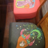 Each chair seat cover has a uniquely painted rabbit design by the owner Tessa! Lots of other beautiful artwork displayed in the restaurant also!  at The Clever Rabbit in Edmonton