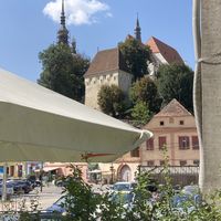 View of the Citadel (behind umbrellas)  at Quattro Amici in Sighisoara