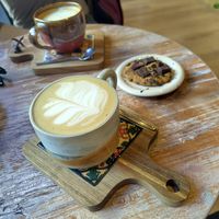 Vegan cappuccino and vegan choc cookie at Indie Café and Concept Store in Cusco