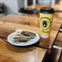 Brekky Burrito and sweet matcha almond milk latte. All vegan for me and absolutely delicious!   at The Buzz Cafe in Kenosha
