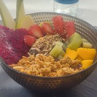 Amazing food, acai bowl with fruit followed by the best vegan ice cream we have ever tasted. at Oops Bubble Waffle Cafè in Tenerife