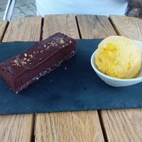Raw chocolate cake with orange ice cream at Le BarOmÊtre in Champniers