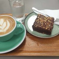 Cappuccino with oat milk and vegan brownie at Wiener Rösthaus im Prater in Vienna