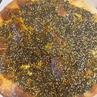 Za’atar manoushe (crispy flat bread)  at Tanoor - Seattle in Seattle