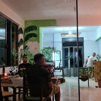 The restaurant. Julian and Mônica cooking for us at Green Life Market in Sarande