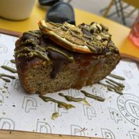 Pistachio mandarin vegan cake   at Pawdy Neighbors  in Dubai