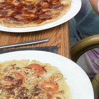 1 sweet pancake with apple banana cinnamon and stroop, 1 savory with onions mushrooms and tomato.  at De Pannekoek in Apeldoorn