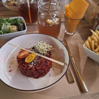Vegan steak tartare with a salad and fries at La Commanderie in Thonon-les-bains
