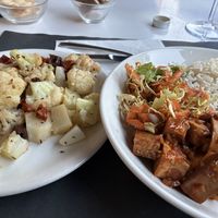 Korean style tofu with a side of grilled cauliflower with olives and sundried tomatoes.   at Osteria di Fuori Porta in Padua