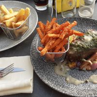 Seitan steak, one with normal fries and one with sweet potato fries. at Restaurant Brasserie Puur Prince in Earnewald