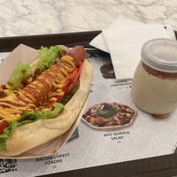 Hotdog sandwich with additional veg and cheese and Side Dessert   at Vegan Burger - Dubai Mall in Dubai