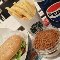 Smoked bacon burger meal and Lotus cheesecake at Vegan Burger - Dubai Mall in Dubai
