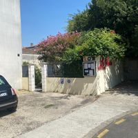 Back entrance to Le Parvis. Goes straight onto the garden and terrace. Wheelchair access through this entrance. Also opposite a large car park. at Le Parvis in Saintes