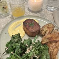 Vegan steak with crunchy greens, garlic sauce and patatoe wedges  at Bistro Verde in Copenhagen