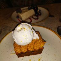 Carrot cake and cheesecake in the background at Bistro Verde in Copenhagen