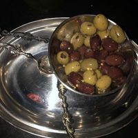 Olives with truffle oil, orange zest and mustard seeds   at MIRZAM COCKTAIL BAR in Gdansk