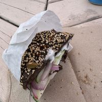 Pumpernickel everything bagel w vegan cream cheese, cucumbers, and red onion. (Sorry the photo quality is trash)  at Bagel Hound in Wellfleet