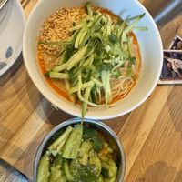 Dan Dan Noodles and cucumber salad  at Pine & Crane in Los Angeles