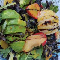 Large salad with fruit, veganised at Massai Mara Beach Club in Torre Del Mar