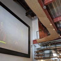 The movie screen and upper seating area. at The Delft Bistro in Marquette