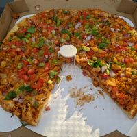 Vegan aloo gobi pizza at Namaste Pizza in Oakland